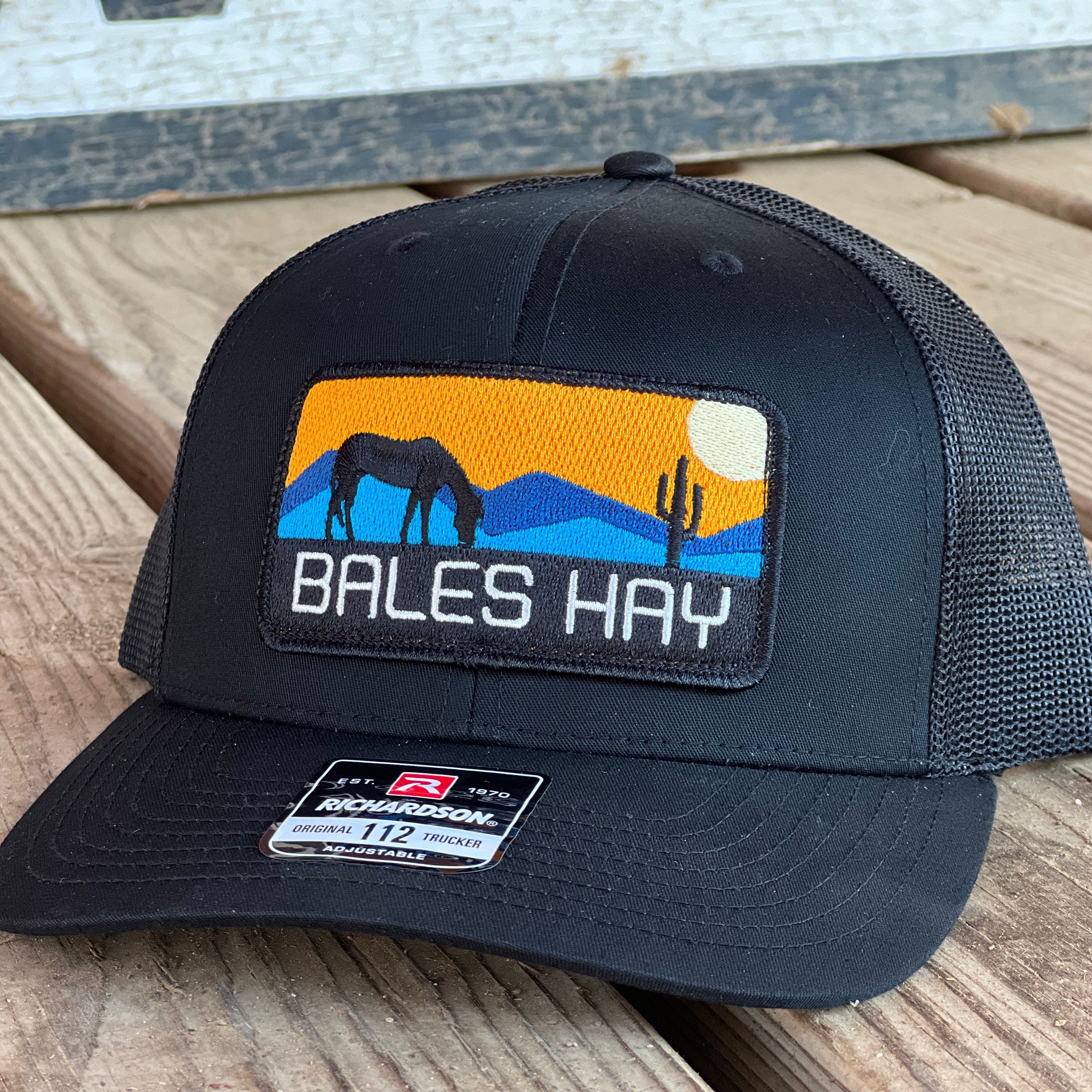 This hat is both well-made and comfortable to wear that features the first patch we ever designed! It represents the horses we feed, and the landscape we live in.  