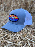 Load image into Gallery viewer, This hat is both well-made and comfortable to wear that features the Arizona flag as the background of our oval patch and a custom stitched Bales quarter horse. 
