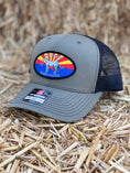 Load image into Gallery viewer, This hat is both well-made and comfortable to wear that features the Arizona flag as the background of our oval patch and a custom stitched Bales quarter horse. 
