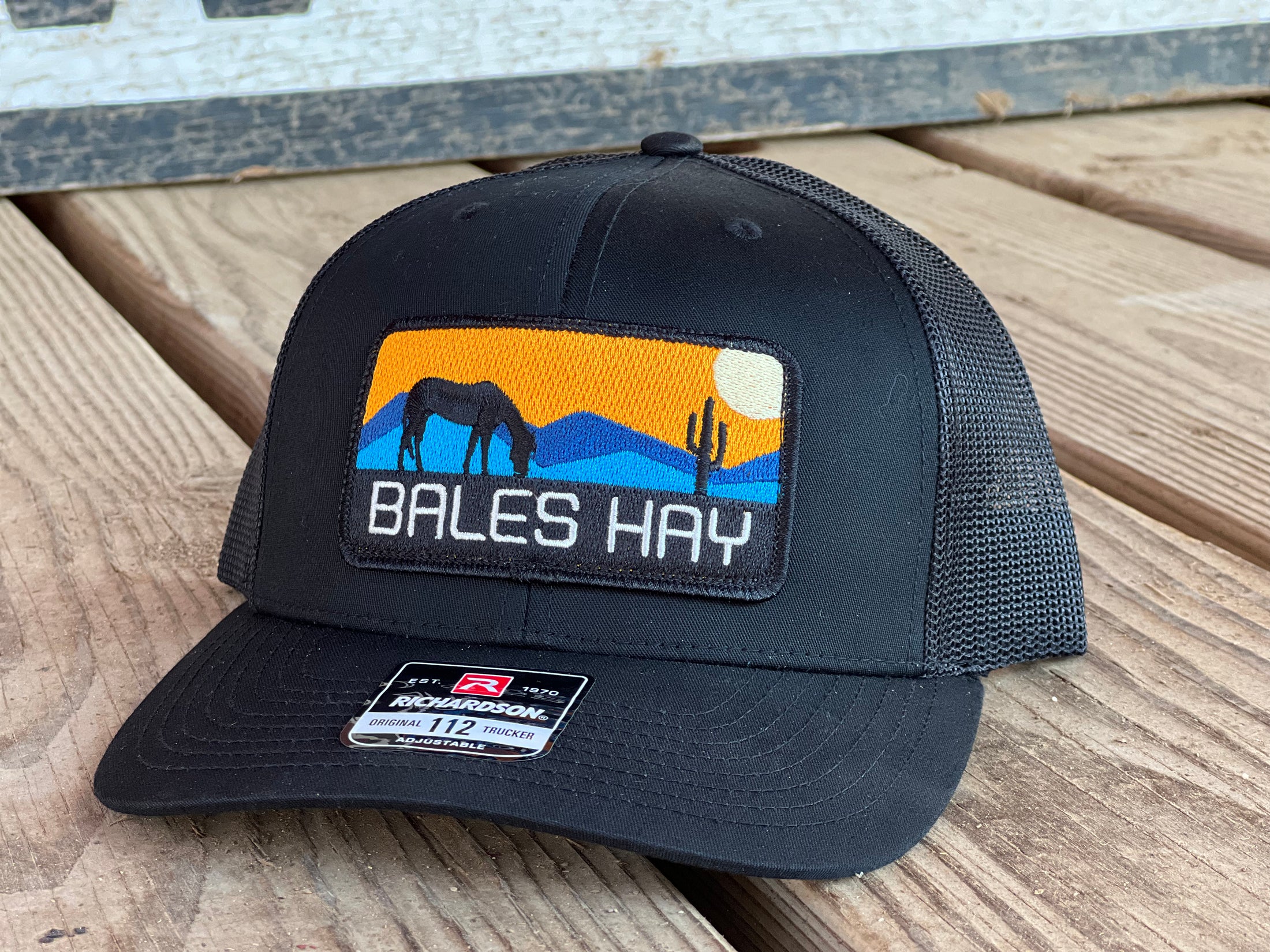 This hat is both well-made and comfortable to wear that features the first patch we ever designed! It represents the horses we feed, and the landscape we live in.  